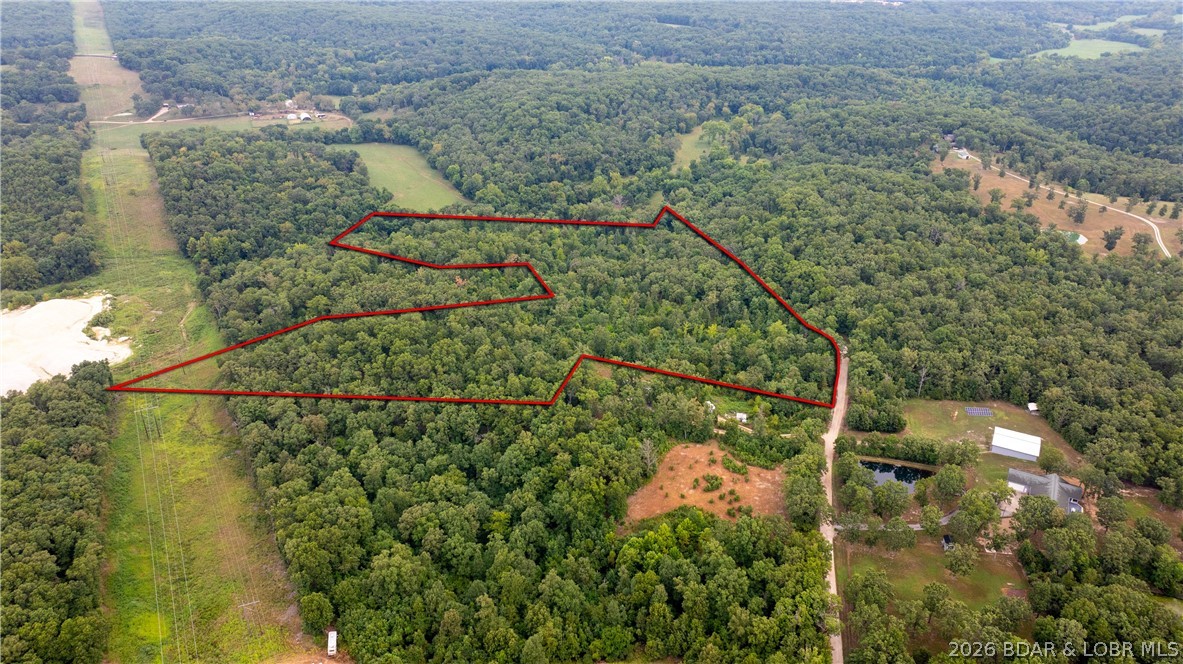 Highly sought-after O Road location in Gravois Mills on the west side of the Lake of the Ozarks! This prime area is known for its privacy, beautiful wooded landscapes, and easy access to the lake. A true blank canvas with no restrictive covenants—perfect for building your dream home, cabin getaway, or holding as a private land investment. Opportunities in this desirable area don’t come around often!