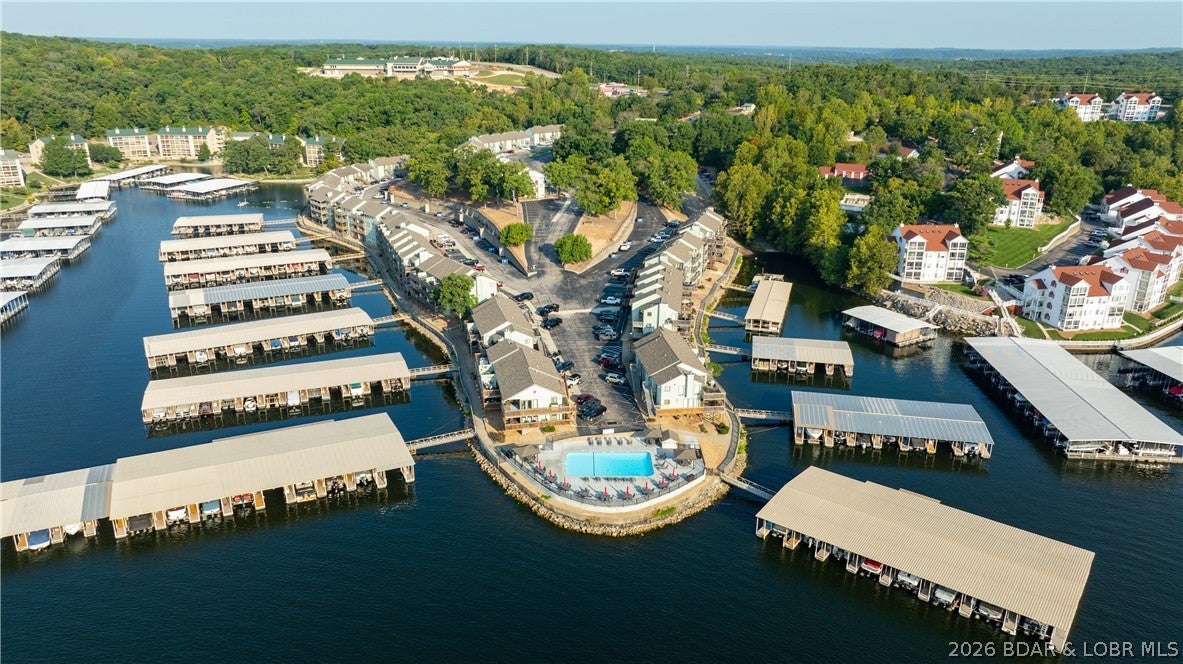 **WALK-IN. TURNKEY. BOAT SLIP. NIGHTLY RENTALS. This one makes lake life EASY!** Welcome to Southwood Shores, where this updated 2BR/2BA condo offers the combination Lake buyers are looking for...NO STEPS, a protected cove setting, impressive Main Channel views & a 12x32 boat slip w/10,000-lb hoist INCLUDED! Inside, you'll find a fresh, neutral interior w/NEW living room furniture, custom blinds & new interior doors. The updated Kitchen features new countertops, upper cabinets, double sink & freshly painted lower cabinetry. Both bathrooms have also been updated, plus the AC is only one year old. Step outside to your private covered deck...the perfect spot for morning coffee, evening cocktails & watching the boats go by. Southwood Shores packs in the amenities w/2 pools including an indoor pool & hot tub, refreshed PICKLE BALL COURT, boat ramp, trailer parking, playground & swim platform. NIGHTLY RENTALS ARE ALLOWED, making this a great lake getaway or investment opportunity. Convenient Horseshoe Bend location close to shopping, dining & entertainment by land or water. Furnished & ready to enjoy...just bring your swimsuit!