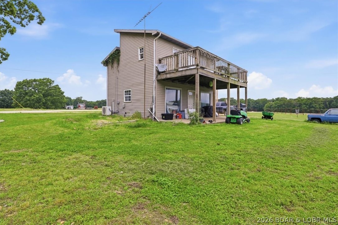 Welcome to your own private country retreat! This cozy one bedroom one bathroom home offers efficient living space surrounded by 6 acres. Perfect for outdoor enthusiast, hobby farmers, or anyone seeking a peaceful retreat from the city. Perfect opportunity to expand or build your dream homestead. The kitchen, living room, bathroom, and laundry are all located conveniently on the main floor, while a more private bedroom upstairs offers vaulted ceilings, a loft, walk in closet, as well as private deck access looking over the property. Don't miss your opportunity to own a manageable home with lots of acreage! Schedule your tour today.
