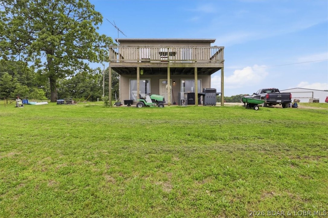 ACT FAST! A rare opportunity to own a private 4-acre country retreat without the overwhelming maintenance. Whether you are looking for a turnkey hobby farm, a peaceful weekend getaway, or a launchpad to build your future dream homestead, this property is ready for you today.Designed for efficient country living, the main floor features an open kitchen, living room, full bathroom, and dedicated laundry room. Upstairs, the private bedroom serves as a true sanctuary, boasting vaulted ceilings, a cozy loft space, a walk-in closet, and direct access to a private upper deck overlooking your sweeping acreage.Fully cleared and usable land gives you endless space for animals, gardens, or future expansion. Properties with this much acreage and a functional home at this price point do not last. Schedule your tour today and secure your slice of paradise before it's gone! Brand New HVAC!!