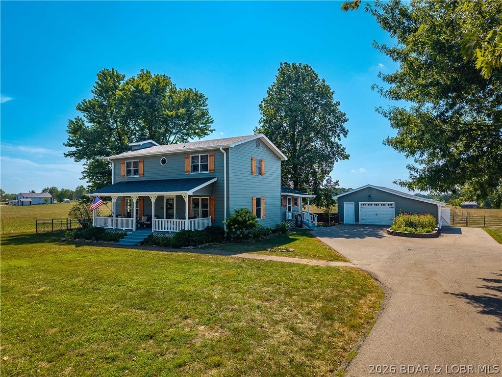 Some properties give you a home—this one gives you the space to build the life you've been dreaming about. Across 20 level, cleared acres, there's room for horses, livestock, hay production, a hobby farm, or simply the freedom that comes with having land of your own. A horse stable is already tucked toward the back of the property, while a stocked pond with a fountain creates a beautiful centerpiece to the acreage. Need space to work? You'll have it with a full-size shop equipped with 220V power, a detached garage, and an additional storage building. The home has been extensively improved during the current ownership, including a newer roof, siding, HVAC, whole-home generator, storm shelter, and substantial interior updates. Step outside to the newer covered patio, already equipped with dedicated 220V power for a future spa and ready for evenings spent overlooking your own piece of the country. The big-ticket improvements are done, the land is open and usable, and the infrastructure is already here. Whether your dream includes horses in the pasture, hay in the field, projects in the shop, or simply a quieter way of life, this property gives you the space to make it happen.