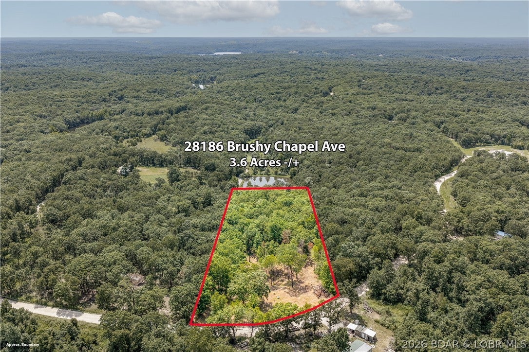 3.6+/- Acres Near Lake of the Ozarks – Build, Relax & Enjoy! Discover the possibilities on this beautiful 3.6+/- acre parcel located near Lincoln, MO, with easy access to Lake of the Ozarks. The property has been partially cleared, offering a great head start for building your dream home, weekend cabin getaway, or recreational camping retreat. A private well is already in place, and electric is conveniently available at the road. The gently rolling terrain is complemented by mature trees, providing a nice mix of open space and natural beauty. Whether you're looking to build, establish a peaceful country escape, or simply have your own piece of land to enjoy, this property offers plenty of potential. Conveniently located approximately 15–20 minutes from both Lincoln and Cole Camp, you'll enjoy a quiet rural setting while remaining within easy reach of local amenities and the recreational opportunities of Lake of the Ozarks. Come take a look and imagine what you could create here!