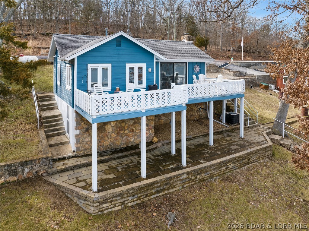 Welcome to your perfect Lake of the Ozarks retreat! This delightful 2-bedroom, 1-bath lakefront cottage sits on a 90-foot waterfront lot offering phenomenal views and deep-water ideal for boating, swimming, and relaxing. Enjoy outdoor living at its finest with a spacious deck and large lakeside patio, perfect for entertaining or simply soaking in the peaceful lake scenery. The home is easily accessible via paved roads right to the door, and the cozy wood-burning fireplace adds that warm, classic cottage charm. This property is being offered almost turn-key (with a few exclusions), making it ready for you to move in and start enjoying lake life immediately. With excellent rental potential, it’s an ideal opportunity for both personal enjoyment and investment. Homes like this—lakefront, deep water, move-in ready—are rare at this amazing price. Don’t miss your chance to own your own piece of paradise at the Lake of the Ozarks!