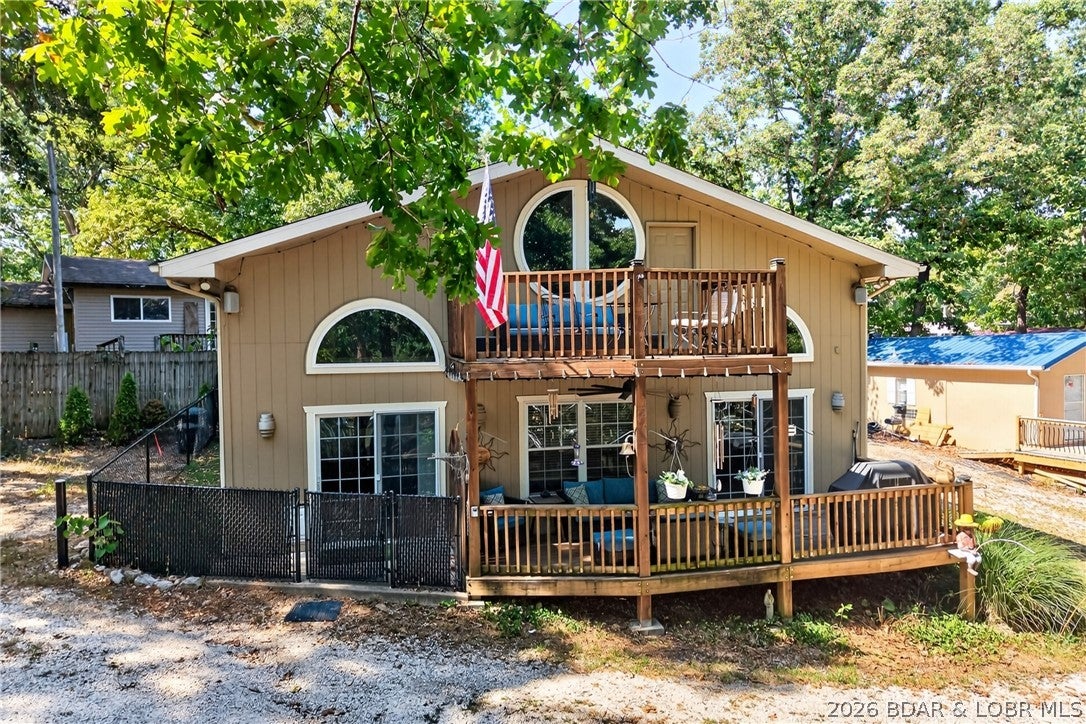 LAKE LIFE STARTS HERE! Enjoy beautiful main channel views paired with the peace and tranquility of a protected cove at the #34 mile marker in Sunrise Beach. This ideal location offers the best of both worlds—peaceful surroundings with easy access to the excitement of the main channel by water.

Recent updates include a new roof, fresh exterior paint, and a new furnace, providing peace of mind for the next owner. Spend your days swimming, fishing, boating, or simply relaxing while taking in the beautiful lake scenery.

Lake access is convenient with a community boat ramp,  a dedicated 10x24 boat slip at the community dock, and boat trailer parking area.  Whether you're looking for a weekend getaway, vacation home, or investment property, this location puts you close to everything—grocery shopping, waterfront dining, entertainment, and all the fun the Lake of the Ozarks has to offer.

Peaceful cove setting. Main channel views. Great fishing and swimming. Convenient by land and water. This is Lake of the Ozarks living at its best!