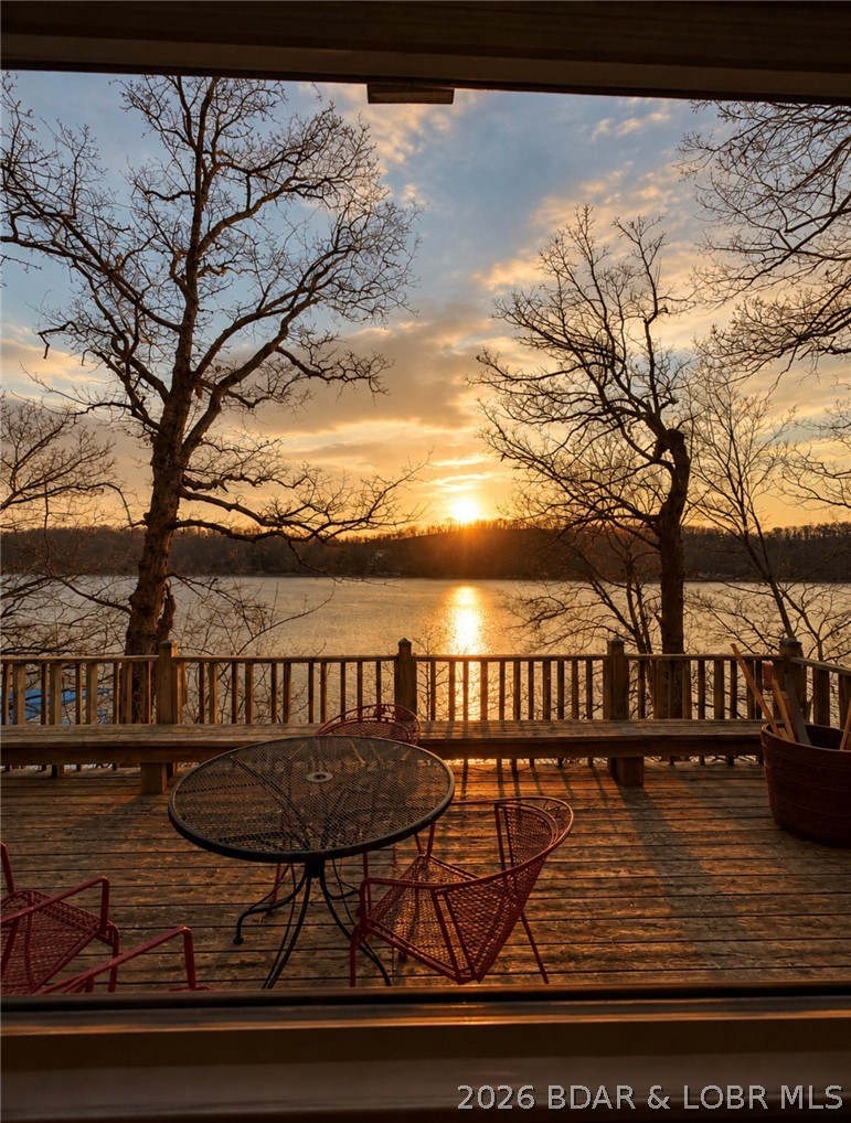 Welcome to 33725 Waterfront Drive in Stover, MO — a beautifully updated, fully furnished waterfront retreat at the Lake of the Ozarks! Whether you’re searching for a full-time residence, weekend getaway, or turnkey investment property, this home is move-in ready and packed with recent upgrades. The remodeled kitchen features factory-painted hardwood cabinets, quartz countertops, tile backsplash, stainless undermount sink with Kohler pull-down faucet, and new Whirlpool stainless appliances. Additional updates include tongue-and-groove ceiling in the lower living area, new carpet, updated blinds, GE combo washer/dryer, new beds and mattresses, and updated bathroom fixtures. Outside, enjoy improved safety and functionality with railing along the parking area and multiple latching gates on deck stairways, making the property more child- and pet-friendly. Offered fully furnished including bedroom sets, dining furniture, living room furniture, flat-screen TV, patio furniture, grill, dishware, and décor. Just bring your suitcase and start enjoying lake life!
