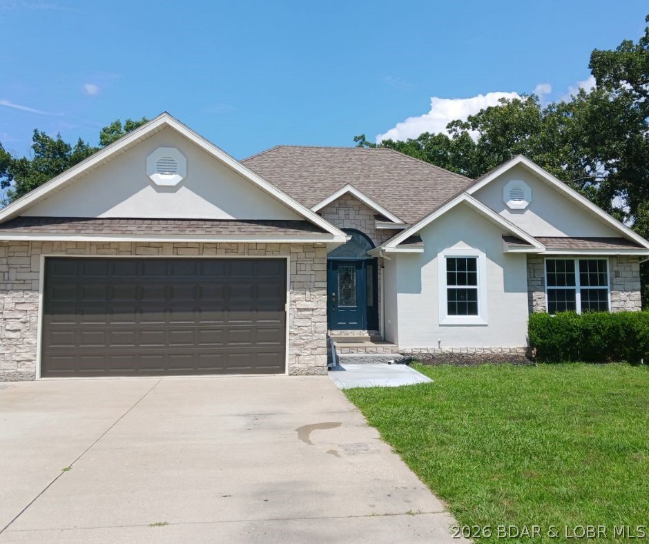 Beautifully maintained 5-bedroom, 3.5-bath home located in the desirable Four Seasons community! BRAND NEW flooring & windows throughout! Painting the exterior of the house and will be completed very soon. The spacious primary suite overlooks your private, backyard and features elegant tray ceilings. French doors lead into the luxurious en-suite bathroom, complete with a soaking tub, walk-in shower, and an oversized walk-in closet. Enjoy entertaining with a covered deck just off the formal dining room—perfect for relaxing or hosting guests. The fully finished lower level boasts 9-foot ceilings, a walkout design, and ample living space, along with two large storage areas. All new windows ordered and will be installed soon. Situated just a couple of blocks from two interior lakes, and community dock access to the Lake of the Ozarks. Walking/jogging path right outside front door. These paths lead right to pools and tennis/pickleball courts. Four Seasons amenities include outdoor and indoor pools, playgrounds, and tennis and pickleball courts—offering something for everyone. Call for a private showing today!