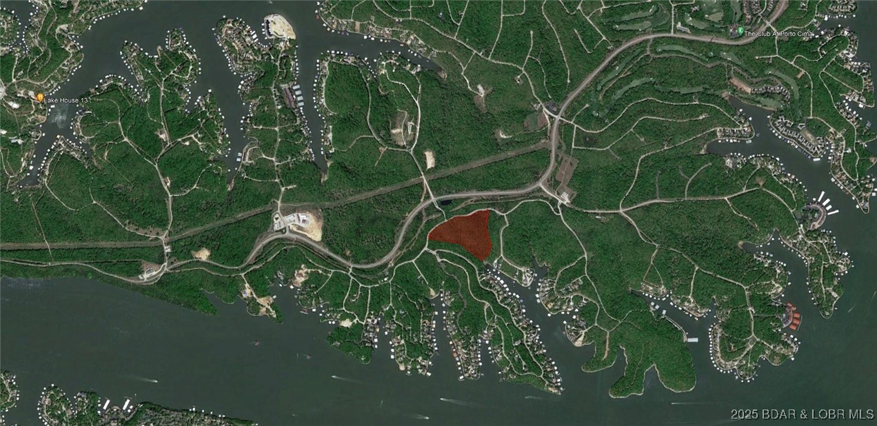 Close your eyes. Picture yourself owning a private, wooded estate in the Lake of the Ozarks’ most coveted neighborhood—The Villages at Shawnee Bend. Envision the legacy you’ll build for your posterity with your own private gated entrance bearing your family name with the lake’s most exclusive address: Villages Way. What if I told you it’s not just a homesite—but literal acreage—now available in the brand-new Villages Way Estates? We are offering an extraordinarily rare chance to secure a secluded estate tract that guarantees absolute privacy, and may well prove to be one of the wisest investment of your life. The Villages at Shawnee Bend isn’t merely the finest community at the lake; it’s also the most centrally located. Minutes from the four-lane, it delivers unmatched access by land and water, plus the region’s fastest fiber-optic internet. Utilities are available to build now: water, sewer, natural gas, high-speed fiber—while resort-caliber amenities await: pool, pickleball and tennis courts. Ownership comes with access to boat slips at nearby Harbor Nineteen, Shawnee Bend’s most anticipated waterfront destination. This is, without exaggeration, a once-in-a-lifetime opportunity.