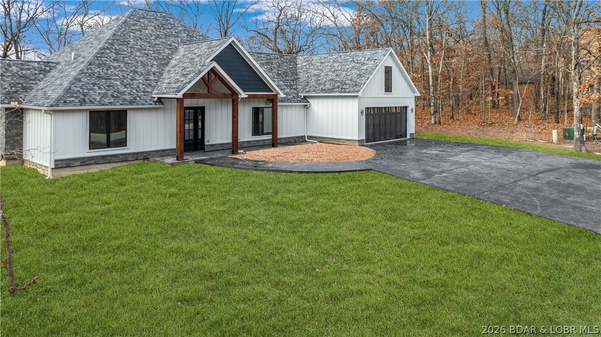 Fall in love with this serene & highly coveted community of Porto Cima, this new construction home blends luxury, comfort & contemporary elegance. Surrounded by the natural beauty of the Lake, inside, the spacious open-concept living area features soaring vaulted ceilings & a striking floor-to-ceiling stone fireplace, creating an inviting setting ideal for relaxing or entertaining. The custom-designed kitchen is a true showpiece with bright quartz countertops, premium finishes & a hidden walk-in pantry. Each of the four spacious bedrooms serves as a private retreat complete with beautifully appointed en suite bathrooms, custom tile & glass showers & floating vanities. Outdoor living is equally impressive with an expansive stamped concrete patio stretching across the back of the home, perfect for entertaining or enjoying peaceful mornings surrounded by nature. A matching stamped concrete driveway leads to the oversized 2-car garage, adding both curb appeal & functionality. You'll enjoy premier community amenities including swimming pools, fitness center, clubhouse, playground, dog park, boat ramp access & the opportunity to lease nearby boat slips for the ultimate lake lifestyle.