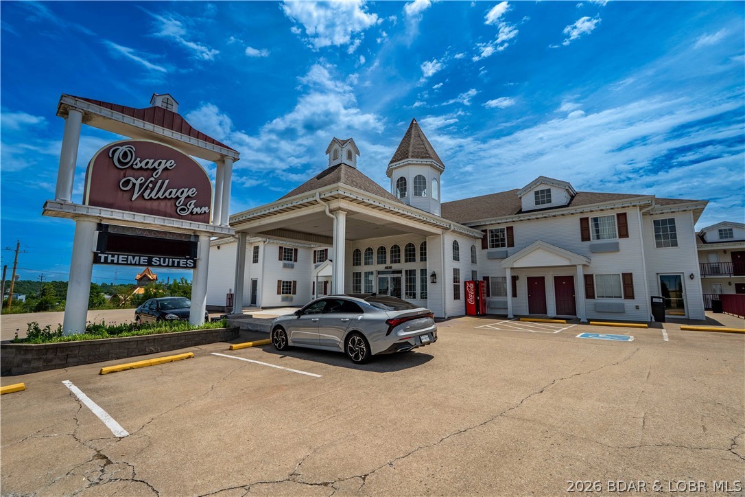 Positioned at the center of major redevelopment & tourism growth, Osage Village Inn presents a compelling value-add investment opportunity at Lake of the Ozarks. This established hospitality asset features approx. 24,000 square feet w/ 53 guest rooms on 1.3 acres & boasts 480 feet of Highway 54 frontage, providing exceptional visibility & accessibility. Strategically located next to the highly anticipated outlet mall redevelopment & just minutes from the upcoming Osage Beach Oasis amustment park, the property is well-positioned to benefit from increasing visitor traffic & long-term area growth. The room mix includes 35 double rooms, 7 king suites, 7 king suites w/ jetted tubs, 2 double jetted suites, & 2 standard suites, offering accommodations for a wide range of guests. Zoned C-1 Commercial, the property provides flexibility for continued hotel operations & future business opportunities. A new roof installed in 2023 helps minimize near-term capital expenses. With its proven location, strong highway exposure, commercial zoning, & proximity to major attractions & redevelopment projects, Osage Village Inn offers immediate income potential w/ significant upside for future growth.