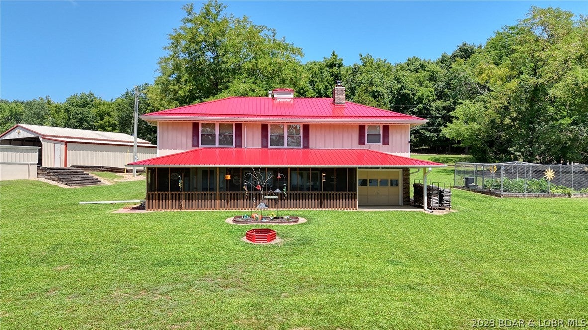 Turnkey lakefront property with approximately 600 feet of shoreline and everything needed to enjoy lake life! This well-maintained home offers 2 bedrooms, 2 full bathrooms, a non-conforming 3rd bedroom, and two separate living areas with plenty of space for family and guests. A whole-house attic fan helps improve airflow and energy efficiency during cooler months, while the screened-in porch provides the perfect place to relax and enjoy the water views. Outside, you’ll find an attached garage, 2-car carport with additional parking, storage garage, and an oversized detached 2-car garage/workshop with room for a boat, side-by-side, tractor, mower, and more. A generator with hookup is included. The detached garage was designed with the potential to add living quarters above. Enjoy a private 20x20 dock with a 10x24 slip, lift, and homemade outdoor shower. Included second-tier lots provide added privacy and prevent future development directly behind the home. Ideal as a full-time residence, weekend getaway, or vacation property!