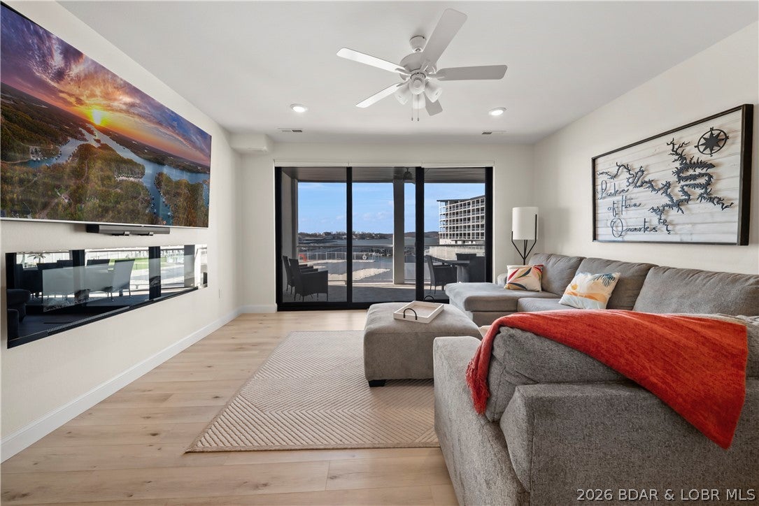 This is you chance to get a Topsider Condo at a great price before the Lake Oasis goes in. Step into easy lakefront living with this beautifully turn key bottom-level residence at Topsider. This spacious 3-bedroom, 3-bath condo offers seamless one-level living w/ an open-concept design, soaring 9-foot ceilings, & floor-to-ceiling glass that fills the main living area with natural light. Enjoy expansive main channel views from your private covered deck—an ideal space to relax or entertain while taking in the lake scenery. Inside, you’ll find granite countertops, a massive tiled walk-in shower, & a thoughtful layout that perfectly balances upscale design with everyday comfort. Topsider delivers true resort-style amenities, including a stunning waterfront pool, sun decks, luxury cabanas, fire pits, grilling areas, elevator access, and a community dock—everything you need for the ultimate lake lifestyle. Located in the heart of Osage Beach, just minutes from premier shopping, dining, and popular attractions. With rentals allowed, this property is perfectly suited as a full-time residence, weekend retreat, or a strong investment opportunity.