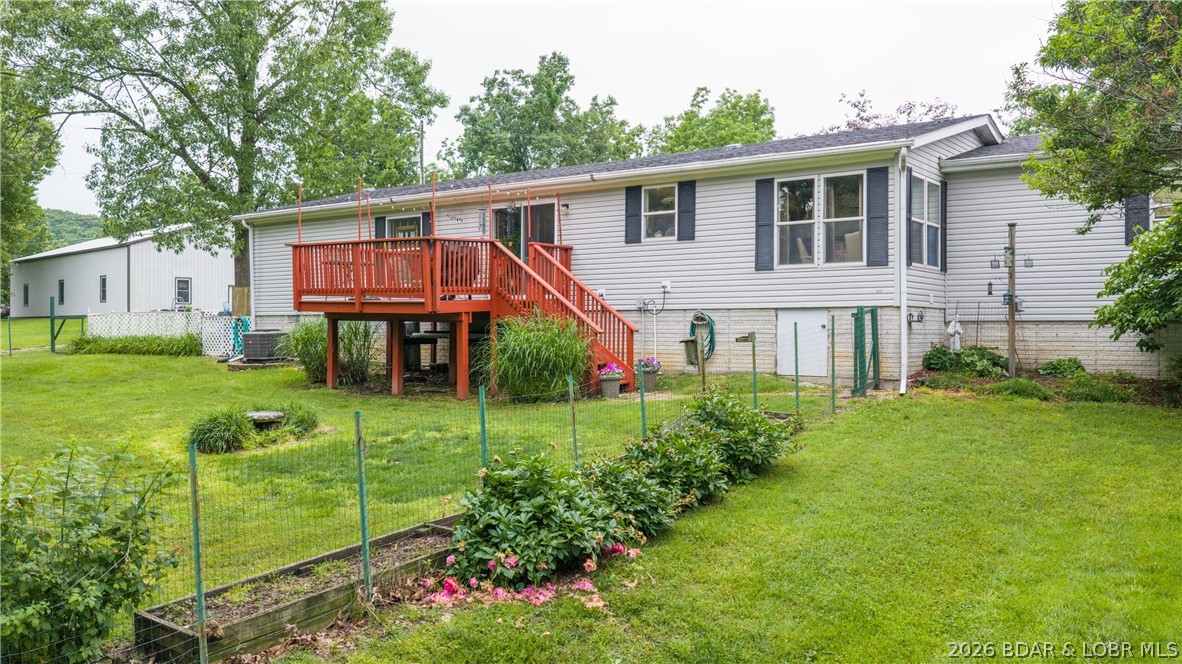 This is the kind of home people move away from the city to find. Tucked away in a quiet lakefront neighborhood off the Little Niangua 7MM (great fishing area), this meticulously maintained 3bed/2bath home offers the complete package with lake access, a shared 2-well dock includes a 10x28 slip & a boat ramp right next door! Bonus room currently used as an office could easily serve as a 4th bedroom. Situated on a FLAT lot with a large yard, fenced in back yard area right off the back deck with raised garden, plum & apple trees, raspberry/blackberry bushes & even an outdoor shower; this property is designed for enjoying the outdoors. Additional features include an above-ground pool, attached 2-car garage with great shelving/storage, 30amp RV/generator hookup, county-maintained roads AND quality 2x6 construction. Inside offers updated finishes, remodeled bathrooms, crown molding throughout, newer flooring, large kitchen with abundant countertop/cabinet space, painted cabinets w/ newer hardware & a spacious primary suite that includes dual vanity granite top & walk-in shower. Clean crawlspace with vapor barrier & dehumidifier already in place! Your next full time home or lake getaway!