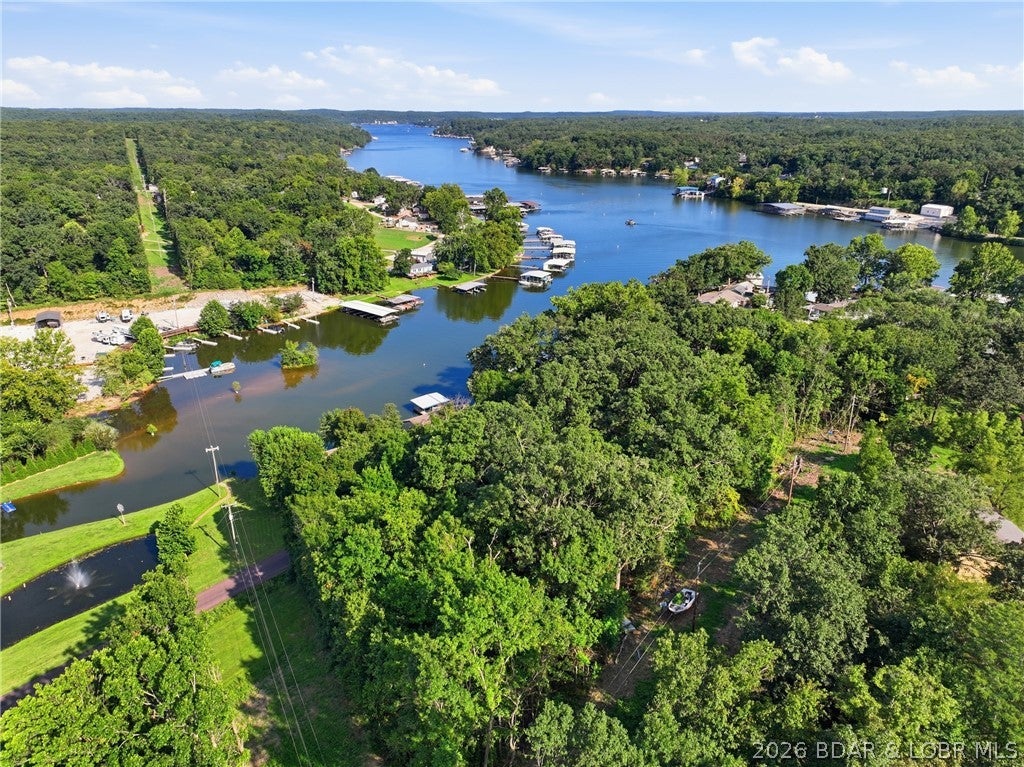 Opportunity awaits in Skyline Heights! This 1.33-acre parcel in Gravois Mills offers an expansive canvas for your Lake of the Ozarks vision. Comprised of multiple lots just off Keepsake Road, this property provides the space and flexibility rarely found near the water, making it an ideal setting for a full-time residence, weekend getaway, or future lake-area retreat. Located in the Versailles School District, you will enjoy convenient access to Laurie, local marinas, dining, and all the West Side has to offer. Outdoor enthusiasts will appreciate the proximity to local boat launch facilities, including the ramp at Keepsake Cottages (available for a nominal fee or waived for slip renters). An additional community boat ramp may be available to qualifying property owners; buyer to verify all access rights and availability. Come explore this prime property and imagine the possibilities!