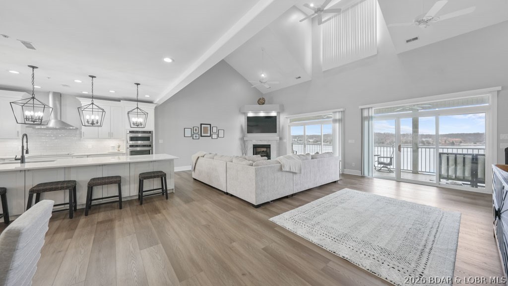 Owner Financing Available. This one-of-a-kind Stoneledge Condominium is the only one with this exclusive floorplan that you do not want to miss out on. Featuring 4 spacious bedroom suites and 2 versatile loft areas, there's room for everyone to spread out and enjoy. Three suites are on the walk-in main level, while the upper-level suite boasts its own private living space—perfect for guests. And the best part? No steps to get inside! With elevator service from the parking level to the pool level, convenience is built right in. The full-length, tiled covered deck offers breathtaking main channel views—an ideal spot for dinners, drinks, and unforgettable sunsets. Love the lake life? You’ll fall for the stunning views right from your covered balcony and oversized 16x48 boat slip—plenty of room for your dream boat and then some. Quality is UNMATCHED at Stoneledge, known for its superior construction and peaceful, upscale environment with no short-term rentals (under 6 months) allowed. Location, views, space, and style—this is lakefront living at its finest!