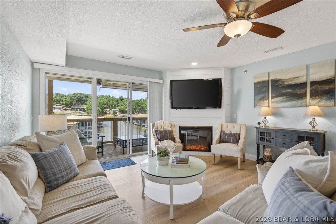 Beautifully renovated 3-bedroom, 2-bath lakefront condo at the 21MM, located just one level down from parking for quick in-and-out. Step out onto the lakeside deck and take your private staircase down to the boat slip, sitting in a calm cove for easy access and visible right from the condo.
You’re just steps from the private beach and both community pools. The updated interior features modern finishes and a move-in-ready layout that works for full-time living, a vacation retreat, or an investment property.
14’ x 40’ boat slip included.