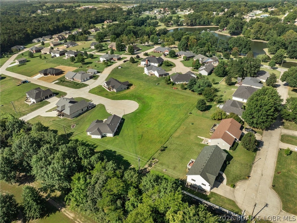 Discover the perfect location to build your dream home! This beautiful .50 acre lot sits close to the park, offering open green space, trails, multiple playgrounds, tennis courts, Frisbee golf and room to enjoy the outdoors just steps from your future front door. Conveniently located near town amenities while still providing a peaceful setting, this property gives you the best of both worlds. Don't miss the opportunity to own land in such a desirable spot!