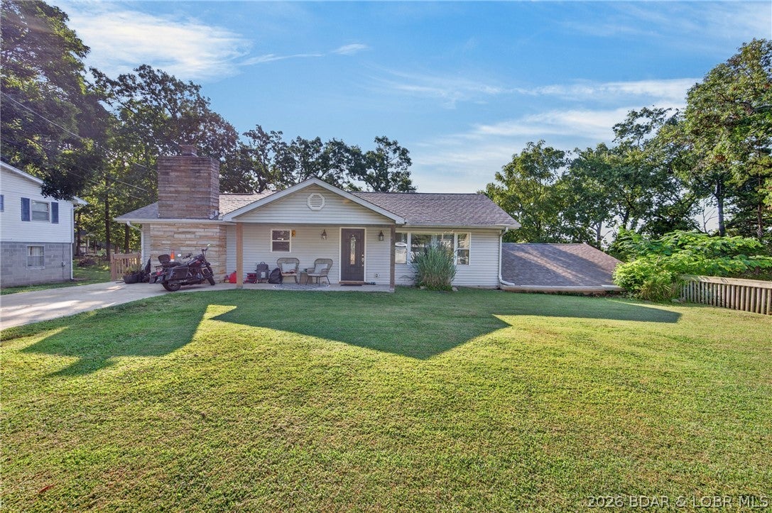 Exactly what buyers are searching for—a spacious in-town home with a large fenced yard and unbeatable convenience! Located close to everything Camdenton has to offer, this 3-bedroom, 2-bath home provides nearly 2,000 square feet of comfortable living space, an attached 2-car garage, and two separate driveways for plenty of parking. The main level features the primary bedroom, full bath, living room, kitchen, dining area, and a cozy den with a wood-burning fireplace. The kitchen is highlighted by beautiful tilework, stainless steel appliances, and solid-surface countertops. Downstairs offers even more room with a second living area, two guest bedrooms, a full bath, and laundry area—an ideal layout for family, guests, or added privacy. The attached garage provides excellent space for vehicles, storage, or a workshop. Outside, the oversized fenced backyard is a rare in-town find, offering plenty of room for children, pets, entertaining, gardening, or future outdoor improvements. Whether you’re looking for a family home or a strong rental investment, this Camdenton property delivers the space, location, and versatility buyers want!