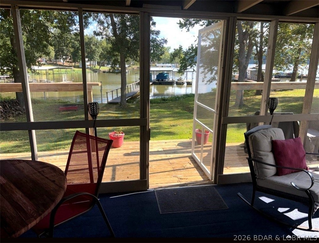 Cute lakefront cabin on a FLAT lot—perfect for Family, Fun, and Fishing! This furnished 3-bedroom, 1-bath retreat is ready to enjoy. Relax on the screened porch, gather around the firepit, or take advantage of the spacious yard for outdoor games and entertaining. A private 2-well dock with hoists in both slips. The boats are included in the package, a 2018 Harris Tritoon Sunliner 220 with a 150 HP motor & a 2000 Lowe Sea Nymph with a 60 HP motor. The pedal boat stays as well. This lakefront home comes with the complete package for years of fun. Come enjoy peaceful lake living on the quiet side of the Lake! This one will fit your Lifestyle.