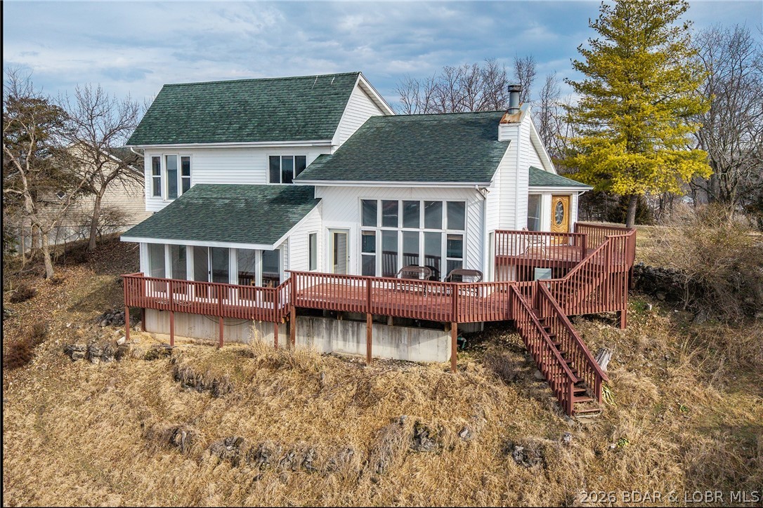 WOW! From the minute you walk in the door, the lake view is amazing- from the dining area to the large living room the views are endless in either direction . From the high vaulted ceilings to the many picture windows you can't put a price on the setting of the wonderful home. The master bath was recently remodeled with an amazing walk in shower .
There is 1/12 ownership in a community lakefront lot on which  to place a dock with just a few steps to the dock