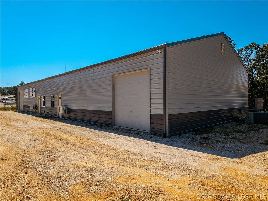 Brand-new construction on five acres with true Highway 5 frontage—this is a commercial opportunity built to generate business, not just for storage. The 4,000-square-foot building is thoughtfully designed with two identical 2,000-square-foot suites, offering exceptional flexibility. Occupy one side while generating income from the other, utilize the entire building for your expanding operation, or add it to your portfolio as a strong investment with an attractive potential cap rate. Each suite features a finished office and private restroom, allowing you to unlock the doors and begin operating from day one. Whether you're an owner-user, entrepreneur, or investor, this property is designed to adapt to your goals while maximizing long-term value. Behind it sits a second commercial pad that has already been leveled and is ready to hookup to water, sewer, and electric, dramatically reducing the time and cost of future expansion. Properties offering this combination of new construction, infrastructure, visibility, flexibility, and future development potential are increasingly difficult to find. The possibilities here are extensive—the only limit is your vision.