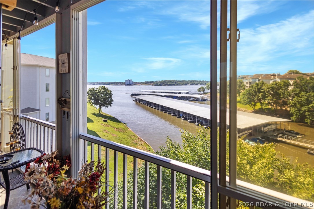 Enjoy lake life at its best in this beautifully updated 3-bedroom, 3-bathroom condo that is truly move-in ready. This spacious, turn-key property offers an open floor plan, comfortable living spaces, plenty of room for family and friends, and a walk-in level entry for easy access. The updated kitchen features granite countertops, soft-close cabinets, and a larger pantry, making it both stylish and functional. You'll also appreciate two large storage areas, providing plenty of room for all your lake toys and essentials. Step outside and take in the lake views from your Suntastic window enclosed deck, complete with an outside full-size refrigerator-perfect for entertaining and keeping drinks cold after a day on the water. Then head down to your boat dock by car and enjoy a day on the water. Whether you're looking for a full-time residence, weekend getaway, or investment opportunity, this condo has everything you need to start enjoying the Lake of the Ozarks lifestyle from day one. Just bring your suitcase and start making memories!
