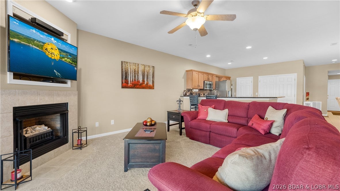 Welcome to your top-floor lake retreat at the 13MM of the Big Niangua! This beautifully maintained 3-bed, 2-full-bath condo offers 1,474 sq ft of living space, comes turnkey, has elevator access, & stunning main-channel views. Enjoy breathtaking sunsets from your own lakefront getaway. The condo features updated bathrooms (2022), newer granite counters & stainless-steel appliances, a new HVAC (2022), & full blackout blinds throughout to help maintain energy efficiency. An electric heat-producing fireplace adds warmth on chilly fall/winter days. Your lake lifestyle is complete with a 10' x 28' boat slip w/ an 8,000 lb. Hydro Hoist, making getting out on the water easy & convenient. The complex is exceptionally clean & well maintained, w/ beautifully landscaped grounds & a sparkling community pool. Located in a quiet, friendly complex where nightly rentals are not allowed, this property offers a peaceful setting for full-time living, weekend getaways, or enjoying everything the lake has to offer w/o the feel of a busy rental community. If you're ready to enjoy incredible sunsets, lake views, & easy access to the water, don't miss your chance to make this top-floor condo your own.