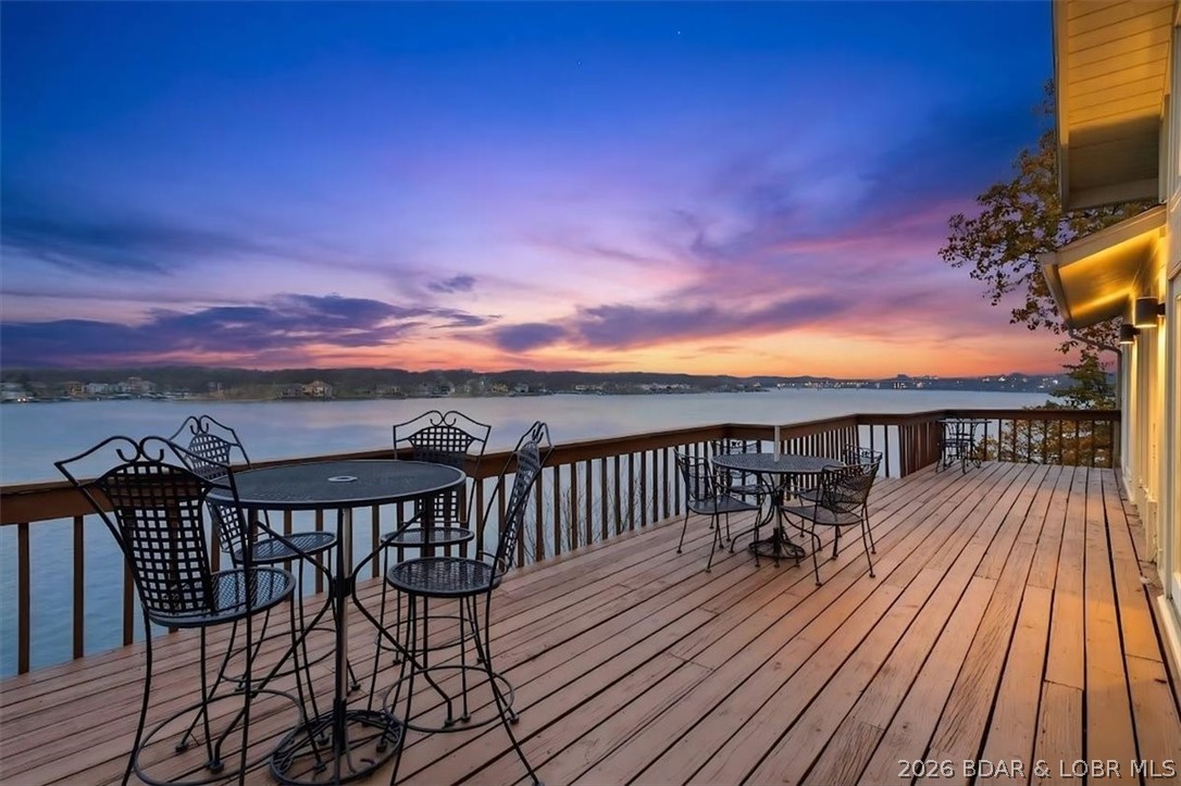 REDUCED--*1st time on Market in 20 years* Piece of Paradise Priced Right!!! This little piece of Heaven is waiting for you on 17 Mile Marker and it would make a fantastic Short term rental investment or full time home. *360 Degree Views* of the Lake from 2- Huge Decks seeing Sunsets that will take your breathe away, 2- Family Rooms, Huge wet bar, gas fireplace on both Levels, Sunporch off kitchen with Spectacular Views of the Lake to enjoy your coffee, & a formal dining room, **This is Priced to sell Now, it's way below appraisal value last yr for $990,000!** Main level has laundry off kitchen, 3- Bedroom Master piece, Master has a walk-in glass shower, and jetted tub. Total of 4.5 Bathrooms! 2- Car att. Oversized Garage. parking is not only Flat, but parking for about 10 cars, gas hook up for BBQ on deck, laundry room on both levels, 2 bedrooms and 3 bathrooms on lower level, huge living room too. *Main Level Living if you prefer!* Absolute Best location to be for Lake events and Action, Fireworks lighting up the sky line, close by is All your shopping, Restaurants, Backwater Jacks is 2 minutes away! NO HOA!