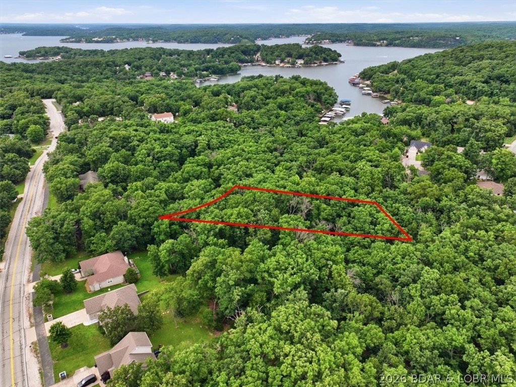 Build your dream home or secure your next investment opportunity with this fantastic lot located on a quiet cul-de-sac in the highly desirable Village of Four Seasons. Offering a peaceful setting with easy access to all the amenities that make lake living so enjoyable, this property provides the perfect canvas for your future plans. As an owner, you'll enjoy access to an impressive selection of community amenities, including multiple swimming pools, tennis courts, playgrounds, a fitness center, walking paths, campground facilities, and more. Whether you're looking to build a full-time residence, vacation getaway, or investment property, this location offers both convenience and lifestyle. Situated in the heart of Lake of the Ozarks, you'll be just minutes from golf courses, waterfront dining, shopping, entertainment, and lake activities. Don't miss this opportunity to own an affordable piece of one of the lake's most sought-after communities and start bringing your vision to life today.
