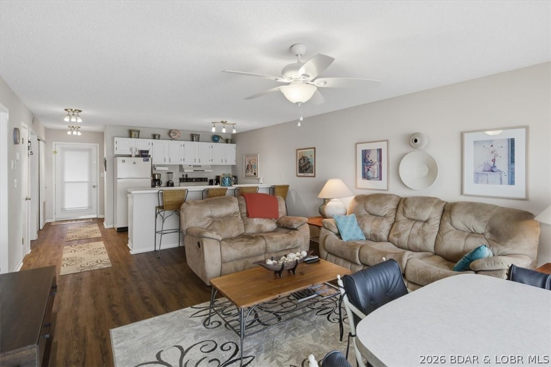 Lake life doesn't get more convenient than this. This 2BR/2BA fully turn-key Osage Beach condo puts you right in the center of it all - with zero steps from parking, elevator access, and sweeping main channel views from your living space and private balcony. Updated flooring, brand-new HVAC (2024), and new picture windows in the living room (2025) mean the big-ticket items are already done. An extra exerior storage closet just outside the unit makes storing lake toys, life jackets, and seasonal items effortless. Your 10x30 boat slip with breakwater protection keeps you lake-ready at all times, while the lakefront pool and martini deck deliver the resort-style experience. Boat or take a short drive to Dog Days, Oasis amusement park, restaurants, shopping, and nightlife. Or, take a left to the calm waters of the State Park. Whether you're looking for a personal vacation home or a high-demand rental, this one checks all the boxes. Nightly rentals allowed, however, this unit has never been rented. SELLER OFFERING $2500 CONCESSION TOWARD APPLIANCES!