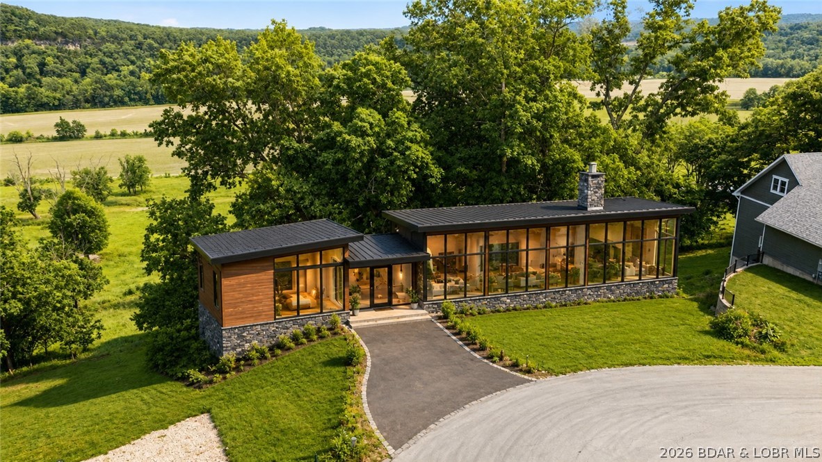 Rare opportunity to own a 1.2+ acre corner cul-de-sac lot in Osage National, a premier Lake Ozark golf course community built around the renowned 27-hole Arnold Palmer Signature Golf Course. This oversized homesite offers an ideal setting for a custom home with added privacy, generous building space, and a desirable cul-de-sac location. Some clearing has already been completed, helping accelerate the building process. Build-job renderings are available for buyers seeking a custom home solution. Residents enjoy access to resort-style amenities including a clubhouse, restaurant, fitness center, pool complex, and championship golf. Located near the heart of Lake of the Ozarks, this property offers convenient access to boating, dining, entertainment, and recreation while maintaining the feel of a private golf community. Whether you're searching for a primary residence, vacation home, or investment opportunity, this homesite combines the flexibility of all builders welcome with the amenities and lifestyle that make Osage National one of the area's most sought-after communities.