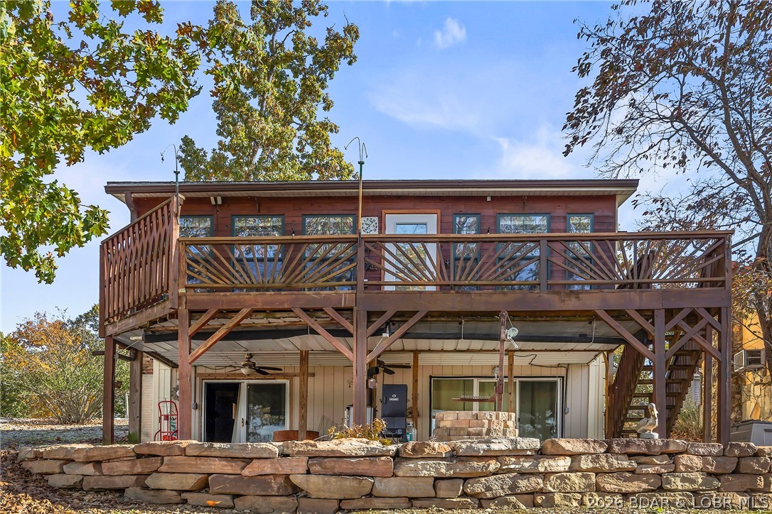 36X46 Man Cave has an office/workshop/Crafts area with a window heat pump unit. Under its wrap around deck you'll find additional storage for your golf cart, riding mower, etc This supper workshop/garage comes with a quaint 3 bedroom, 2 bath cabin with lots of personality. Sellers are motivated! Come check it out.