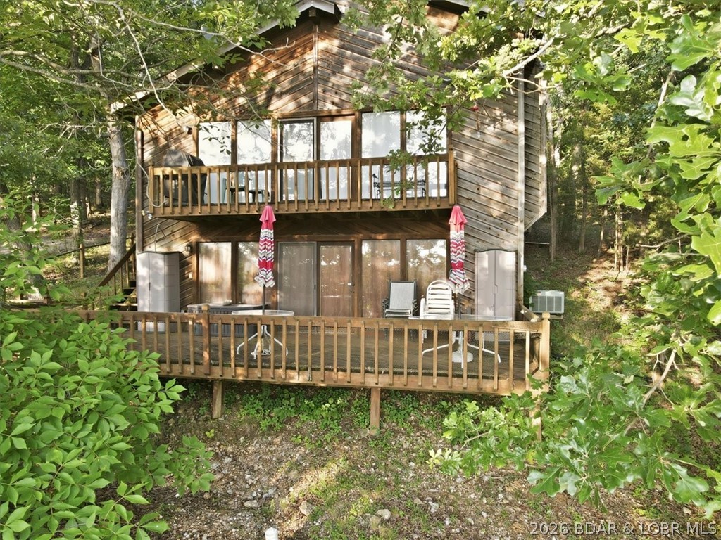 Welcome to 50 Benton Road, your chance to own a slice of paradise nestled within the beauty and tranquility of the LOTO State Park. This 3-bed, 2-bath home offers 1,568 square feet and boasts stunning lake views from its coveted second-tier location.
Situated directly across from an undeveloped waterfront lot, you'll enjoy unobstructed views of the lake and the peaceful natural surroundings that make this area so special. Whether you're looking for a full-time residence, weekend retreat, or investment property, this home delivers the perfect blend of relaxation and recreation.
Included is a private single-well dock with a PWC slip and a spacious swim platform, making it easy to spend your days boating, swimming, fishing, or simply soaking up the lake lifestyle. Surrounded by the serenity of the State Park, you'll appreciate the quiet setting, abundant wildlife, and breathtaking scenery while still being just minutes from all the conveniences and attractions Lake of the Ozarks has to offer.
If you've been dreaming of lake views, private dock access, and a peaceful waterfront lifestyle without the waterfront price tag, 50 Benton Road is the opportunity you've been waiting for.