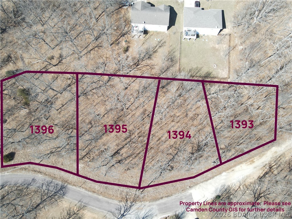 Discover an incredible opportunity in **Camelot Estates** in the heart of **Lake of the Ozarks**! These two adjoining lots on Ashton Lane are being sold together, offering the rare chance to build right on the lot lines and create one expansive homesite tailored to your vision. Even better—the two neighboring lots are also available, giving you the potential to own the final four lots at the end of the street for unmatched privacy and minimal drive-by traffic.

With four lots combined, you could construct a second structure such as a detached garage, workshop, or even an additional home—ideal for multi-generational living or extra storage for all your lake toys. Water, sewer, and gas hookups are available, making your build process even smoother.

Enjoy close lake access with nearby boat ramps and a conveniently located marina. Camelot Estates amenities include a boat ramp, boat trailer parking, campground, clubhouse, community pool, road maintenance, and tennis courts. Secure your slice of lake life and build exactly what you’ve been dreaming of! Call Matthew Loftis with BHHS Lake Ozark Realty for more information.