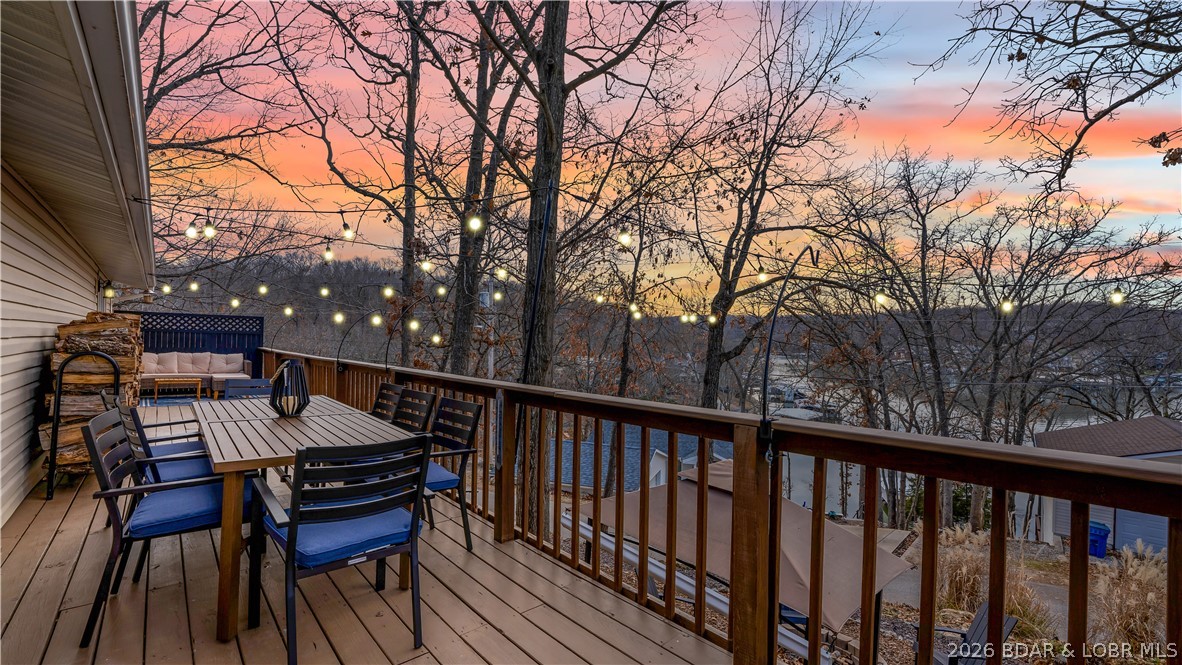 Affordable lake area living in the heart of Osage Beach with updates, convenience, and lake views. This 3 bedroom, 1 bathroom home offers 960 square feet and is ideally located near Hwy 54, shopping, the hospital, and local favorites like Millers Landing - where you can rent a boat slip! Positioned 2nd tier, the home captures a nice lake view while maintaining easy access to everything the area has to offer. Inside, the home has been tastefully updated with new flooring, newer appliances, updated bathroom, and is being offered with stylish furnishings throughout, creating a true move-in ready opportunity. Outside, enjoy a newly added outdoor fireplace entertainment area, a second entertainment area in front of the home, and plenty of parking for guests. The property has been meticulously cared for and is set up for both personal use or rental potential. Whether you're looking for a weekend lake retreat, full-time residence, or a nightly rental opportunity, this property offers flexibility, location, and value all in one.