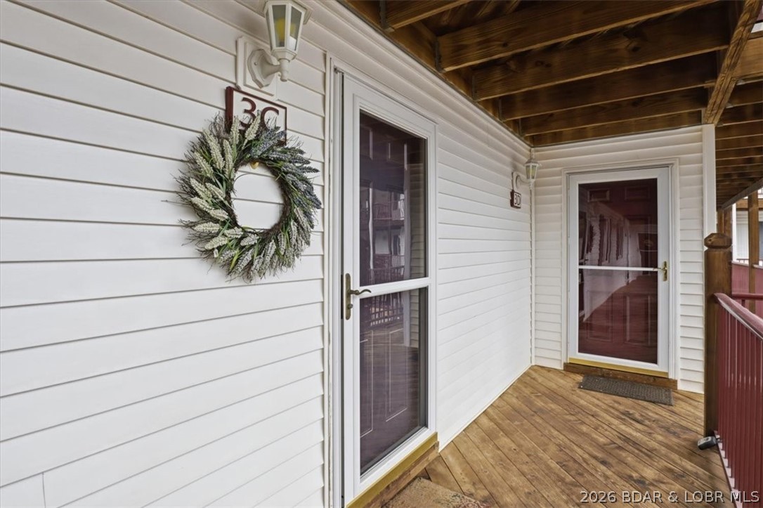 Welcome to Clearwater Condos in Camdenton, MO, on the Lake of the Ozarks, perfectly situated at the 8.5-mile marker of the Big Niangua. Enjoy stunning main channel views from this turnkey, fully furnished condo featuring 2 bedrooms, 2 full bathrooms, and a 12 x 32 boat slip on E Dock. Unit is on the 3rd level, just 6 steps up from the parking lot. The Kitchen offers a refrigerator, microwave, breakfast bar, dining area, and full-size washer/dryer area conveniently located nearby. The family room boasts a cozy corner fireplace, gorgeous lake views, and a sliding glass door to the covered deck. The owner’s suite includes a walk-in closet, full bathroom with dual sinks, lake views, and deck access for peaceful mornings. The guest bedroom connects to a second full bathroom with a shower and linen closet. A PWC slip (PH-3) is available for purchase. Clearwater’s amenities include two pools (one heated), a community pavilion hosting events like live entertainment and bingo, plus firepits, a playground, and dog relief areas throughout the property. Quarterly HOA is $914 and includes Trash, Internet, Pest Control, Reserves, Etc. Annual Taxes in 2025 were $846