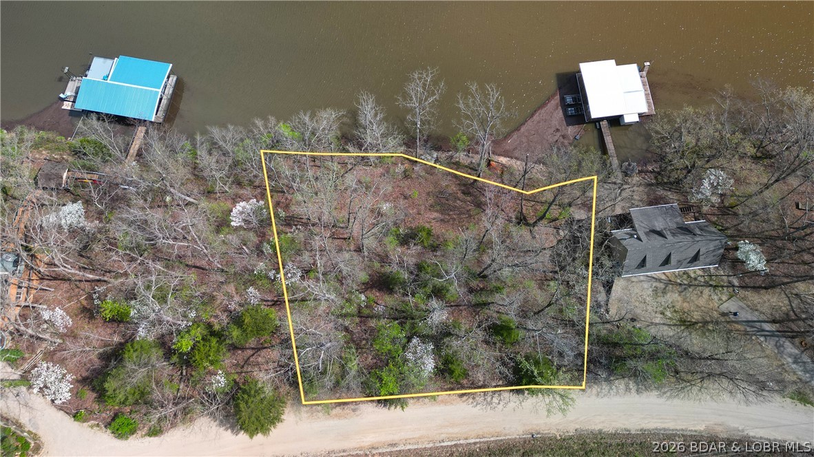 Are you ready to build your dream lake home? This prime piece of lakefront in Proctor Cove at the 55 MM offers 160 feet of shoreline with the perfect blend of cove protection and open views—ideal for swimming, relaxing, and soaking up the lake lifestyle. Located on the West Side, you’ll enjoy a quieter atmosphere while still being close to top restaurants, marinas, and lakefront hotspots. Lakefront lots with this combination of frontage, location, view and price are rare—don’t miss this opportunity.
