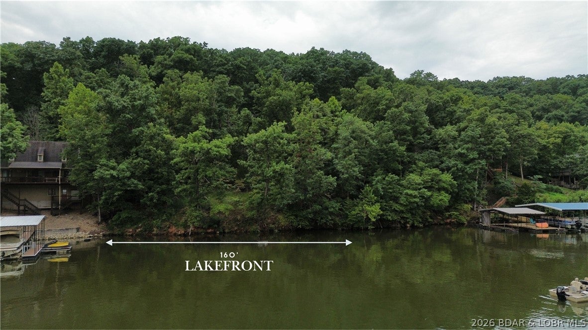 Are you ready to build your dream lake home? This prime piece of lakefront in Proctor Cove at the 55 MM offers 160 feet of shoreline with the perfect blend of cove protection and open views—ideal for swimming, relaxing, and soaking up the lake lifestyle. Located on the West Side, you’ll enjoy a quieter atmosphere while still being close to top restaurants, marinas, and lakefront hotspots. Lakefront lots with this combination of frontage, location, view and price are rare—don’t miss this opportunity.