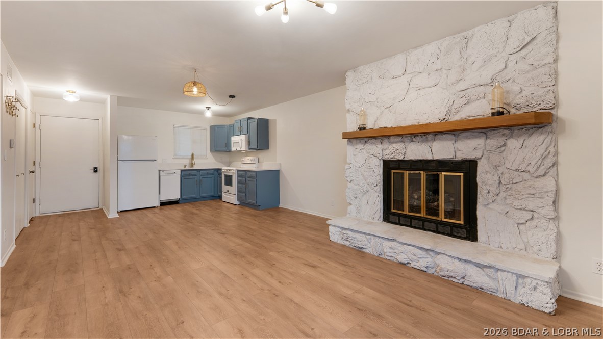 Enjoy lake life this summer with this beautifully updated end-unit condo located at the 21-mile marker of Lake of the Ozarks! This 2-bedroom, 1 full bathroom condo offers added privacy and extra natural light thanks to its desirable end-unit location. Recent updates include fresh paint, updated light fixtures, granite countertops, new flooring, and a stylish new bathroom vanity. Step out onto the large, covered deck and take in stunning main channel views while enjoying your morning coffee or evening sunsets. Boating enthusiasts will love the included 10x24 boat slip, making it easy to get out on the water all season long. Conveniently located within walking distance to Shorty Pants and just down the road from Redhead Lakeside Grill, you’ll be right in the heart of some of the lake’s best dining and entertainment. The community also offers a refreshing pool, perfect for cooling off on those hot summer days. Whether you’re looking for a weekend getaway, vacation rental opportunity, or full-time lake retreat, this condo is ready to be furnished to your style and enjoyed immediately!