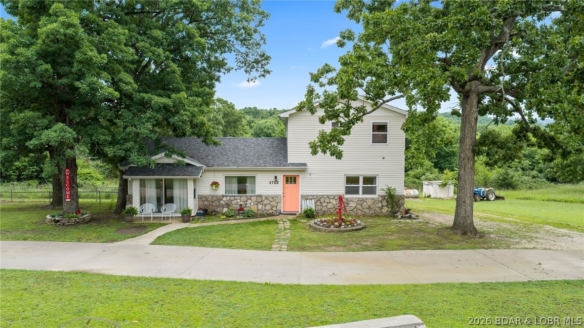 Beautiful 3-bedroom, 2-bath home located right in the heart of Osage Beach! The main level offers convenient one-level living with bedrooms on the main floor, while the upper level includes an additional private primary suite with its own bath. Bonus opportunity to purchase the additional 7.8 acres directly behind the property. Extremely rare opportunity to find acreage of this size zoned agricultural within Osage Beach city limits. Conveniently located close to the hospital, schools, shopping, dining, and everything Osage Beach has to offer. Call today to schedule your private showing!