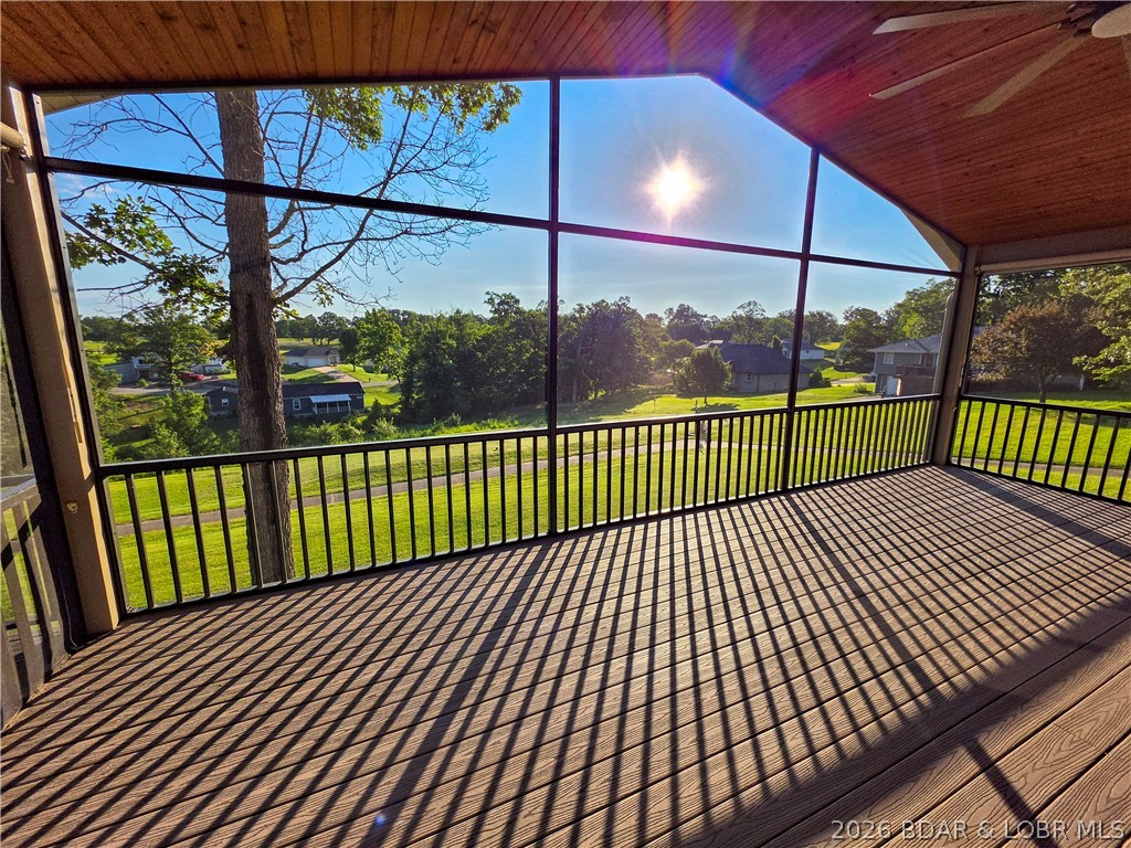 Pride of ownership is evident throughout this updated, 3-bed, 3-bath home overlooking the golf course. Designed to make the most of its peaceful setting, the home offers beautiful views from nearly every angle. Start your morning with coffee on the new screened-in deck, relax on the covered patio below or simply enjoy the scenery through the large windows filling the home with natural light. The open kitchen has an eat-in bar & flows into the dining & living areas where the fireplace creates a warm gathering space for cooler Missouri evenings. The spacious primary suite includes a walk-in closet, walk-in shower & private deck access—perfect for tranquil mornings or relaxing at the end of the day. A large bonus/recreation room offers flexible space for entertaining, hobbies, guests, or a home office. The attached garage, detached storage shed, and lower-level storage room provide plenty of space for vehicles, a golf cart & outdoor equipment. Located in a welcoming golf course community with an on-site restaurant, this beautiful property is ready for any family & an ideal option for anyone ready to move off the lake while staying close to everything they love about the area.