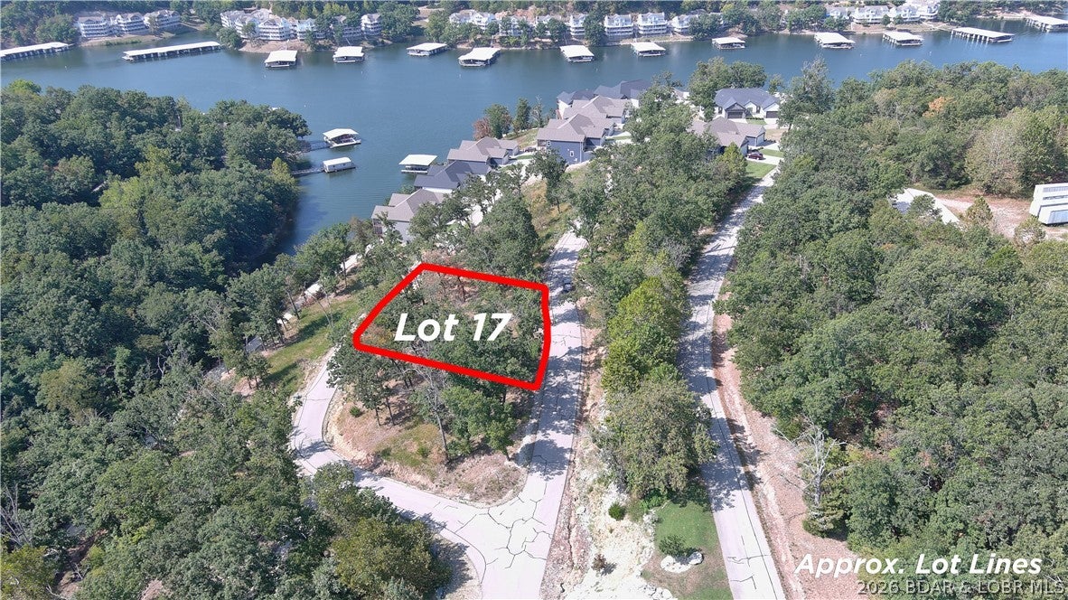 Amazing opportunity to purchase a lot with a water view in a well established subdivision. This lot will allow you to build a private home or a Villa in the Villas of Tuscany Subdivision. This location is one of the most ideal lots within the subdivision. Amenities are already in place with water & sewer, internet access through Spectrum. You will enjoy the amazing pickle ball court, community pool & bath house, and golf cart path down to the community docks. Community dock slip is available for additional purchase. Note- proposed structure shall be approved by Architecture Review Committee and landscaping will also need to be approved. (Subdivision will maintain landscaping of home, just as a Villa). Buyer to verify hook-up fees to water & sewer. Great opportunity to build your dream home that allows for some maintenance free lake enjoyment or a Villa for yourself or for investment. Wonderful location by land and water.
