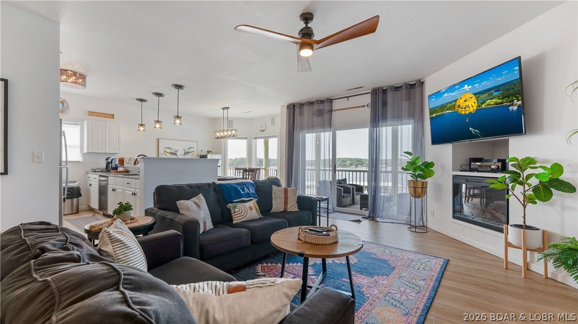 Wake up to sweeping main channel views and enjoy the privacy of this beautifully updated top-floor end unit at Regatta Bay. This 3-bedroom, 3-bath condo has generated more than $154,000 in gross rental revenue since March 2023, creating an outstanding opportunity for buyers seeking both a Lake retreat and proven income potential. With no neighbors above or on one side, the bright, open floor plan offers abundant natural light, luxury vinyl plank flooring, quartz countertops, stainless steel appliances, a cozy fireplace, and stylish finishes throughout. The spacious primary suite features a walk-in closet and private bath, while two additional bedrooms and baths provide plenty of room for family and guests. Step outside to the large lakeside deck and enjoy the view, or head down to your 14x36 boat slip conveniently located behind the building. Offered fully furnished and turnkey, this property is ready to enjoy or continue as a rental. Regatta Bay amenities include pools and a clubhouse, all near H. Toad’s, Shady Gators, the Bagnell Dam Strip, shopping, dining, and entertainment.
