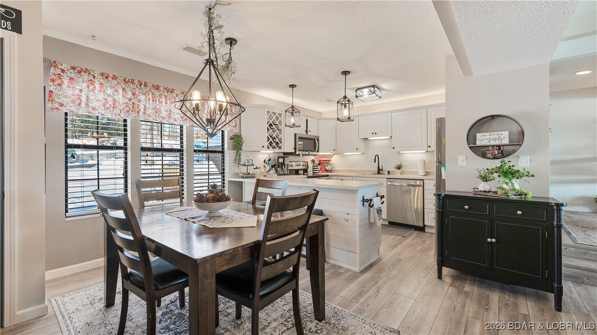 Beautifully updated waterfront condominium with stunning lake views and a 10’ x 28’ boat slip (L14). This exceptional unit offers open-concept living, thoughtful upgrades, and true resort-style amenities in one of Lake Ozark’s most desirable communities.

The primary suite features a brand-new, spa-like bath with a walk-in shower and double vanity—truly a showstopper. Updates throughout include new sliding doors in all rooms, subway tile backsplash in the kitchen, newer appliances, updated flooring, and all new interior doors. The unit is being sold furnished,making it move-in ready.

Enjoy an enlarged deck with breathtaking waterfront views—perfect for relaxing or entertaining. With only six steps to the front door, this unit offers easy access and convenience. The community is golf-cart friendly and adjacent to The Cove Golf Course (Hole #4), with The Watering Hole located by the fire pit overlooking the course.