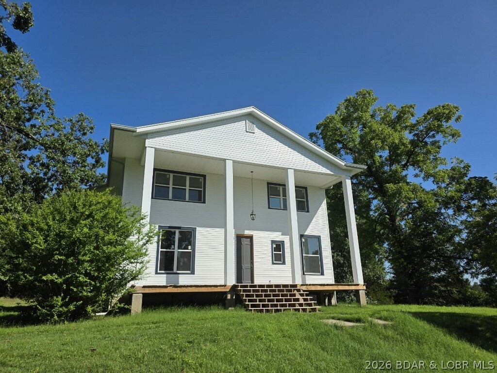 BARGAIN PRICED - MOTIVATED SELLERS!  Historic Charm Meets Modern Luxury on 1.5 Acres in Warsaw, Missouri.  Welcome to 1105 Lay Avenue — a beautifully restored historic mini-mansion where timeless elegance meets today’s modern comforts. Situated on a sprawling 1.5-acre lot just minutes from downtown Warsaw, this stately residence offers the perfect blend of character, space, and location. Inside, extensive renovations provide peace of mind and turnkey convenience, including a brand-new kitchen with all new appliances, updated bathrooms, new siding, windows, roof, HVAC system, and more.  The expansive front yard creates a grand welcome, while the private backyard offers room to relax, entertain, or create your own outdoor retreat. With no rental restrictions, this property presents incredible flexibility — ideal as a spacious primary residence, multi-generational home, vacation getaway, income-producing rental, or even a retreat center.  Located just minutes from Lake of the Ozarks, Drake Harbor, and Truman Lake, outdoor recreation, boating, dining, and shopping are all within easy reach.  This rare Warsaw gem offers historic grandeur, modern updates, and unlimited potential.