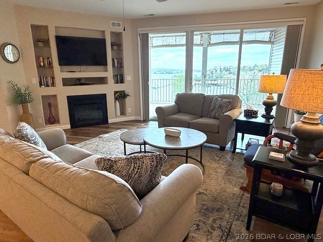 Introducing a peaceful, turn-key lakefront condo in CapeRoyale at Ski Harbor Condominiums, complete with a garage and boat slip for your convenience! Experience effortless living in this 3-bedroom, 3-bath residence, ideally located in the heart of Osage Beach. With limited steps to the elevator, accessing both the dock and pool is a breeze, allowing you to fully embrace the breathtaking panoramic views of the 17MM of the Lake of the Ozarks. Step inside to discover a spacious open floor plan enhanced by upscale finishes, including granite vanities, tile flooring, and stylish remote-controlled fans that create a calm and welcoming atmosphere. 
Unwind on your private balcony while soaking in the spectacular main-channel views, or take advantage of the outstanding resort-style amenities that include two elevators, a gated entrance, and impeccably maintained common areas.This fully furnished condo is move-in ready—just bring your suitcase and dive into lake life!