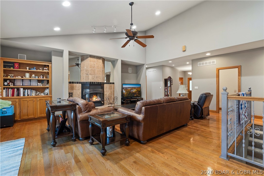 Welcome to this incredible home nestled on 6 gentle acres in the highly sought-after Lake of the Ozarks State Park, offering the perfect blend of comfort, privacy, and functionality. This 4-bedroom, 3.5-bath home features over 5,000 sq. ft. of thoughtfully designed living space. The vaulted living room is filled with natural light and complemented by two wood-burning fireplaces, while the spacious kitchen offers a walk-in pantry and seamless flow for everyday living. The oversized primary suite features dual walk-in closets, a jetted tub, walk-in shower, and direct laundry room access. Upstairs, Jack-and-Jill bathrooms add convenience, while the expansive lower level with soaring ceilings provides endless possibilities. Outside, enjoy the wraparound porch with a screened-in section perfect for watching deer and wildlife. A 3-car attached garage, 30'x50' detached shop, and abundant storage provide room for vehicles, hobbies, and lake toys. Just 12 minutes from Osage Beach with blacktop roads, no HOA, and unmatched privacy, this property truly has it all! Call today to make it yours!