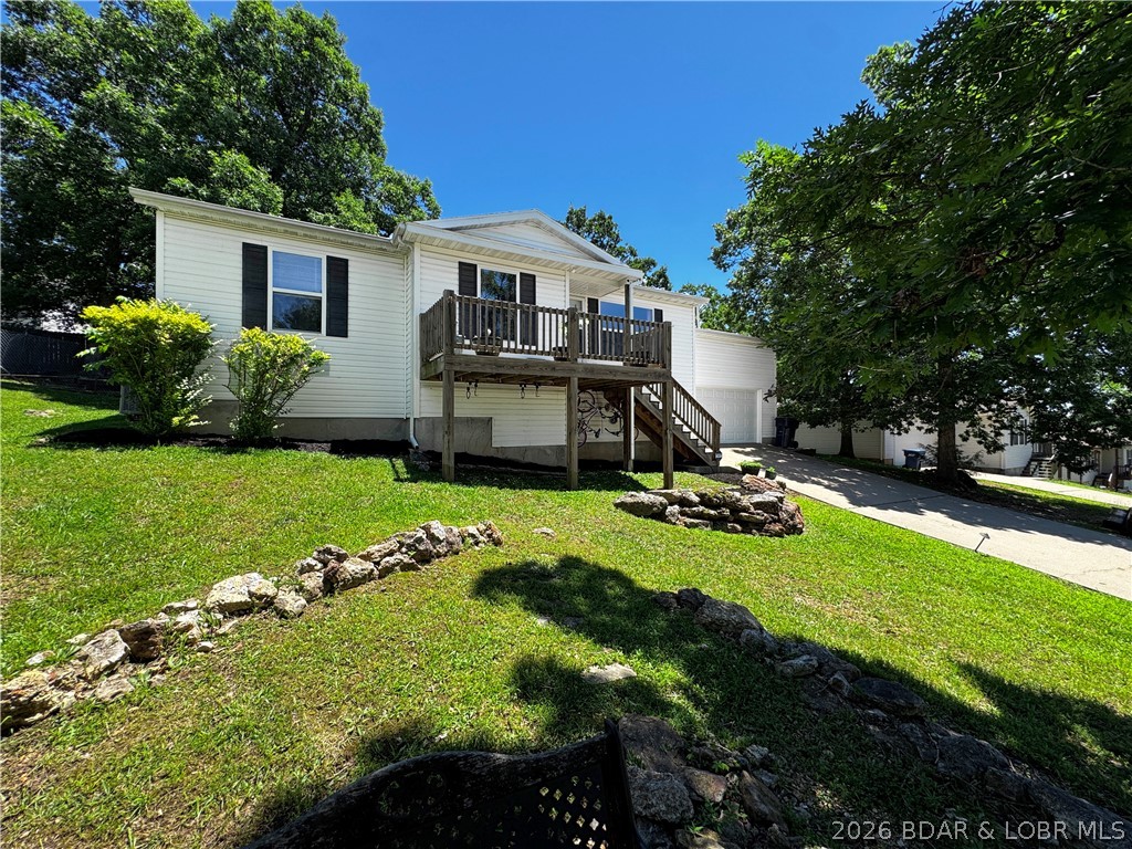 Conveniently located in the heart of Camdenton, this 4-bedroom, 2-bathroom home offers the space, flexibility, and outdoor living areas that are hard to find at this price point. The open living and eat-in kitchen create a comfortable flow for everyday life, whether you're hosting friends or simply winding down at the end of the day. The primary suite features a walk-in closet and private bath complete with a jetted tub, while both bathrooms include dedicated linen storage. Above the attached 2-car garage, the spacious bonus room currently serves as the fourth bedroom and offers endless possibilities as a second living area, game room, home office, workout space, or guest retreat. Step outside and enjoy multiple outdoor living spaces, including an open deck up front and a covered deck/patio area overlooking the fenced backyard. There's plenty of room for pets, gardening, entertaining, or simply enjoying your own outdoor space. The attached garage provides additional storage and workspace potential, and the convenient in-town location places schools, shopping, dining, and the Camdenton Square just minutes away. Call off your search and come look at this one today! New 50 Year Roof