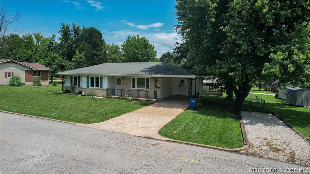 Affordable living with room to spread out! This 3-bedroom, 1-bath home offers a functional layout and sits on a spacious lot with plenty of outdoor space to enjoy. The chain link fenced backyard is perfect for pets, kids, or entertaining, while the attached carport provides convenient covered parking. Need extra storage or a place for hobbies? The 10x24 workshop/storage shed features a 4x6 lift door, making it ideal for tools, lawn equipment, motorcycles, or a small workshop. An additional driveway offers plenty of extra parking for guests, trailers, or recreational vehicles. Whether you're a first-time homebuyer, looking to downsize, or searching for an investment property, this home offers great potential at an affordable price. Conveniently located close to schools, shopping, dining, and everything Eldon has to offer. Schedule your showing today!