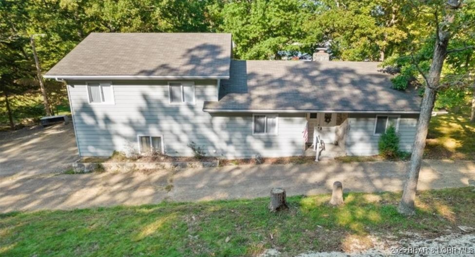 You read that right—a lake home on Horseshoe Bend with a garage, workshop, and a beautiful private setting, all at a price that’s hard to find in today’s market. Inside, the cozy fireplace, formal dining room, and casual eat-in kitchen make it easy to settle in, whether you're hosting dinner or grabbing a bite before heading out on the water. The two-level layout offers great separation and flexibility for guests, family, or quiet weekends. Step outside and enjoy the expansive deck—perfect for grilling, gathering, and taking in the peaceful surroundings. The seller previously had a dock in place, so adding one again is an option for the next owner. A fantastic opportunity to enjoy lake living with space, comfort, and character.