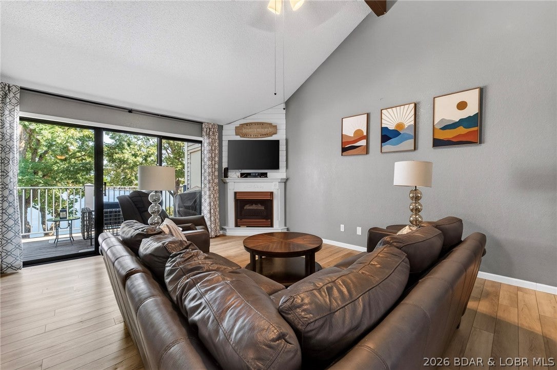 Hidden Gem with Amazing Views! This top-floor 2-bedroom, 2-bath condo offers incredible lake views, vaulted ceilings, and a spacious open feel. The primary bedroom features a loft area perfect for extra storage, a home office, or cozy sitting area. A PWC slip and hoist are included, with additional boat slips available for rent from other owners. Enjoy the clubhouse, community pool, and beautiful waterfront martini deck. Excellent location by land and water!